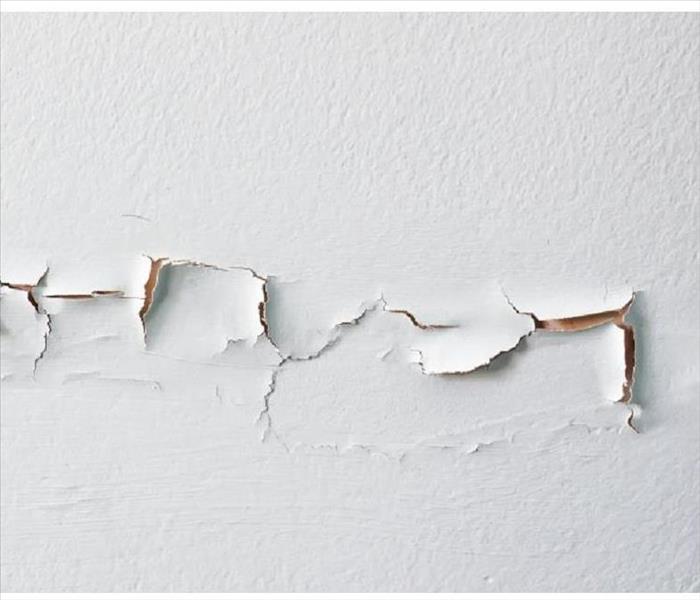 White wall with torn drywall